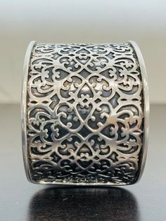 This intricate patterned cuff bracelet is made is sterling silver and is 1 5/8 inches wide.  It is substantial; 60.2 grams!  This bracelet has an arrowhead hallmark and is stamped 925.  This cuff was made in India and is in excellent condition.  SO PRETTY! Elegant Stamped Cuff Bracelet, Elegant Stamped Silver Cuff Bracelet, Elegant Wide Band Stamped Jewelry, Elegant Antique Silver Cuff Bracelet With Oxidized Finish, Formal Silver Etched Cuff Bracelet, Formal Etched Silver Cuff Bracelet, Feminine Wardrobe, Glendale Az, Pearl And Diamond Ring