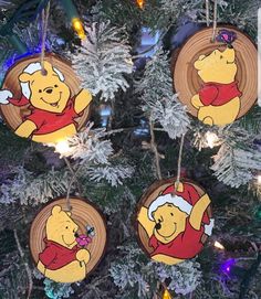 winnie the pooh ornament hanging from a christmas tree