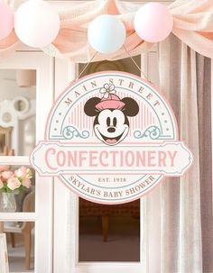 there is a sign that says confectionery with minnie mouse on the front