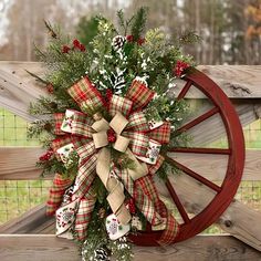 a christmas wreath on a wagon wheel