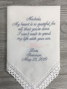 "Mother of the Groom Wedding Gift ideas, Personalized Embroidered Wedding Handkerchief Honoring your parents on your wedding day is a beautiful way to show appreciation. This Beautifully Embroidered Wedding Handkerchief makes a great Keepsake for a life time of memories. Give a special mother-in-law to-be the gift of cherishment for her son's wedding day. A thoughtful gift for her on a joyous and precious day of her son's wedding!! ATTENTION: The default handkerchief is white with navy thread fo Elegant Personalized Handkerchiefs For Bridal Shower, Personalized Handkerchiefs For Bridal Shower, Personalized Elegant Handkerchiefs For Bridal Shower, Customizable White Handkerchiefs For Anniversary, Custom Text White Handkerchiefs For Wedding, Mom Handkerchief Wedding, Mother Of The Bride Hankie, White Custom Text Handkerchiefs For Wedding, White Handkerchiefs With Custom Text For Wedding