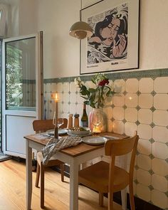 a dining room with a table and chairs next to a sliding glass door that leads outside