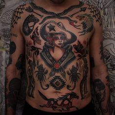 a man with many tattoos on his chest