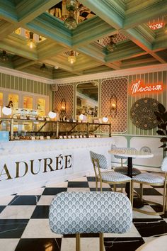 the inside of a restaurant with checkered flooring