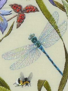 the dragonflys and other insects are on white fabric