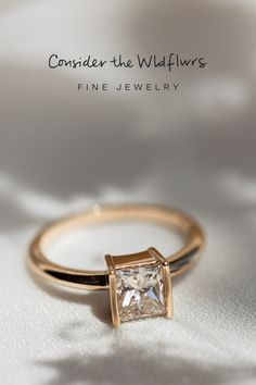 The Mae Diamond Ring evokes modern charm and sophistication with an angular, partial-bezel design. This ring features an approximate 1.06 carat princess cut diamond that is sure to dazzle and delight. #diamondring #modernring #engagement #engagementrings #ctwf Luxury Square Cut Ring For Promise, Luxury Square Cut Rings For Promises, Elegant Baguette Cut Jewelry With Tension Setting, Timeless Promise Ring With Square Cut, Luxury Princess Cut Solitaire Jewelry, Modern Jewelry With Princess Cut Diamond, Modern Radiant Cut 14k Gold Wedding Ring, Modern Moissanite Asscher Cut Wedding Ring, Modern Square Cut Diamond Jewelry