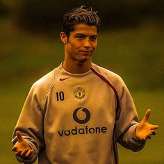 a soccer player is giving the thumbs up sign