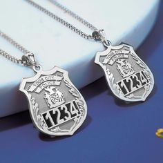 "Guaranteed Christmas Delivery Police Officer Gifts, Police Badge Necklace. Create a Personalized Police Badge Pendant Necklace with Any Number & Department, the perfect Police Office Gifts - Each Police Badge Necklace can be personalized by Specifying the Police Department Name and Number. - Model in photo is pictured wearing a 3/4 Inch x 1 Inch Size Medal. - Police Badge Necklace is available in 3 Sizes in Solid Sterling Silver, Gold Plated, Solid 14k Yellow & White   Gold. - Sterling Silver and Gold Plated Police Badge Necklace includes an 18\" chain.  - Looking for a different state seal? Put which seal from what state your looking for and we can add it for you! This Police Officer Badge necklace is available with ANY Police Department, Any Badge Number and ANY Name! MORE INFORMATION - Police Retirement Gifts, Police Officer Badge, Badge Necklace, Police Jewelry, Uk Police, British Police, Number Gifts, Police Gifts, Aztec Calendar