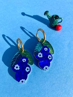 A berry, berry sweet touch to any look! 🫐✨ ✦ Lightweight, acrylic laser-cut earrings with a nickel-free post. ✦ Measures approximately 2.5 x 1". ✦ Handmade with love in Louisville, KY. Musical Artist, Berry Berry, Kitchen Plants, Accessorize Bags, Laser Cut Earrings, Cut Earrings, Fruit Earrings, Book Clothes, Bandana Hairstyles