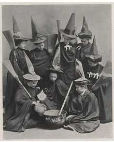 an old black and white photo of children dressed up as witches