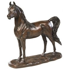 a bronze statue of a horse on a white background