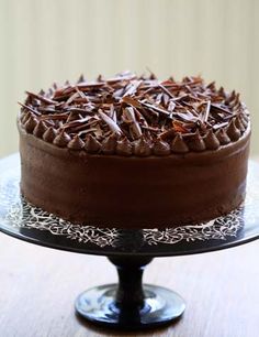 a chocolate cake sitting on top of a wooden table