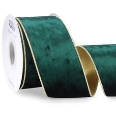 a roll of green velvet ribbon with gold foil on the side and one roll in front