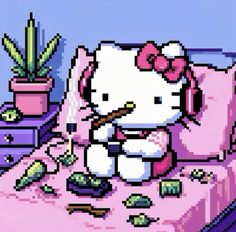 a hello kitty sitting on top of a pink bed next to a potted plant