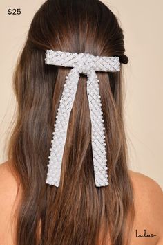 The Lulus Exemplary Sweetness White Pearl Beaded Bow Hair Clip is guaranteed to bring an undeniable charm to any of your fave looks! Sleek satin and sheer mesh come together to shape this delicate hair accessory with a bow silhouette adorned with gleaming faux pearls and dainty silver beads that create a mesmerizing design throughout. A silver barrette clip closure will effortlessly secure your tresses to ensure the best hair day ever! 5" wide and 7. 5" long. 80% Acrylic, 20% Alloy. Imported. Lu Bow Silhouette, Beaded Bow, Bow Hair Clip, Lulu Fashion, Good Hair Day, Bow Hair, Best Hair, Barrette Clip, Bow Hair Clips