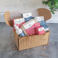 a box filled with lots of different types of skin care products on top of a table