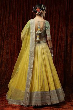 Lemon yellow silk chanderi lehenga with attached cancan, featuring badla, kasab and Hyderabadi micro pearls embroidery. Comes with a silk chanderi sea green padded blouse with rose gold kasab, pearl and crystal drop detailing. Paired with a yellow net dupatta.
Components: 3
Pattern: Embroidered
Type Of Work: Badla, Kasab, Pearls, Crystals
Neckline: V-Neck
Sleeve Type: Elbow
Fabric: Lehenga and Blouse: Silk Chanderi, Dupatta: Net, Lining: Taffeta Silk
Color: Yellow
Other Details: 
Blouse:
Padded Chanderi Lehenga, Pearls Embroidery, Lehenga And Blouse, Chanderi Dupatta, Yellow Lehenga, Pearl Work, Pearl Embroidery, Padded Blouse, Blouse Silk