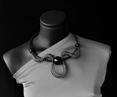 "Statement black and silver collar, Short elegant necklace, Contemporary necklace, Unusual necklace, Fashion necklace, Modern necklace, Chic necklace. Statement eye catching black and silver necklace, Contemporary choker necklace. Attractive stylish modern collar.  Light and comfortable to wear, easy to combine with many outfit styles. Bold necklace for those who love bohemian style. Necklace Is very comfortable and on memo wire so you can wear it as choker, or as classic necklace when you lock Black Choker Necklaces For Party, Modern Silver Necklace For Evening, Modern Black Party Choker, Silver Bib Necklace Choker For Evening, Black Choker Necklace For Evening, Elegant Black Necklaces For Evening, Modern Party Choker Necklace, Elegant Black Necklace For Evening, Modern Black Metal Choker