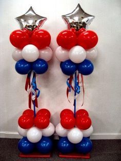 two red, white and blue balloons are on display