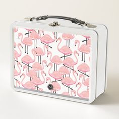 a lunch box with pink flamingos on it