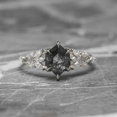 a black and white diamond engagement ring