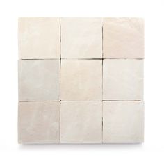 several square white tiles arranged on top of each other