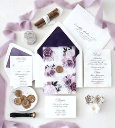 the wedding stationery is laid out and ready to be put into the bride's bouquet