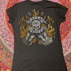 Size L Slim Fit Black Color Nwot Please See Photos For More Details & Approx Measurements From A Smoke Free/Pet Free Home Rocker Tops With Skull Print For Concert, Black Rock Style T-shirt For Festival, Rock Style Fitted T-shirt For Concerts, Black Skull Print Rock Top, Black Rock And Roll Top For Music Festival, Black Rocker Style Tops For Music Festival, Fitted Rock Style Top For Festivals, Jeweled Skull, Guitar Shirt