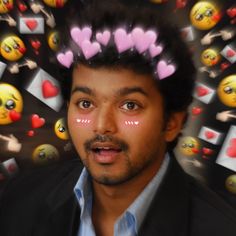 a man with hearts on his head surrounded by emoticions