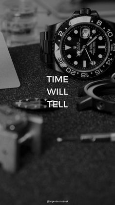 a black and white photo of a rolex watch with the words time will tell