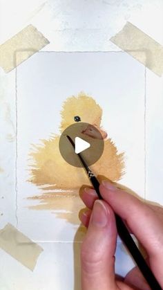 someone is painting a duck on the paper