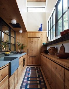 the kitchen is clean and ready for us to use it's natural wood accents