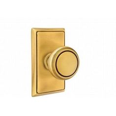 an image of a brass plated door handle with knob on the front and side