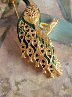 This is a vintage, Bob Mackie, gold tone metal, green rhinestone and email, peacock, pin or brooch. All sales are final. This measures just under 3.5 inches across. Don't forget to stop in at my other Etsy shop... http://www.etsy.com/shop/xtdesigns. Follow me on Twitter at... MyYiayiaHadThat@MyYiayiaHadThat. If you have a wish list or are looking for something specific, please ask. I may have exactly what you are looking for. As always please convo me with any questions or concerns regarding thi Gold Brooches With Peacock Design As Gift, Vintage Bob Mackie, Peacock Brooch, Vintage Bob, Sterling Silver Cat, Bob Mackie, Wish List, Gold Tone Metal, Brooch Pin