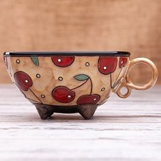 a coffee cup sitting on top of a wooden table