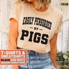 Show your love for pigs with this funny and adorable t-shirt or sweatshirt. The "Easily Persuaded by Pigs" design is perfect for pig enthusiasts and makes a great gift for friends and family who can't resist the charm of these lovable animals. Whether you're looking for a casual tee or a cozy sweatshirt, this product is sure to bring a smile to your face and add some humor to your wardrobe. Ideal for parties, casual outings, or lounging at home, it's a must-have for any pig lover. Grab yours today and showcase your piggy pride! ❤️ HOW TO ORDER ❤️   1. Check out all the photos for sizing and color options.📏 2. Choose your perfect size and color from the drop-down menus!✨  3. Click "ADD TO CART" and feel free to add as many as you wish! 🛒  4. Hit "PROCEED TO CHECKOUT" and get ready to enjo Pig Shirt, Pig Design, Pig Shirts, Cute Pig, Lover Sweatshirt, Pig Lovers, Cute Pigs, Branded Sweatshirts, Laid Back Style