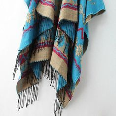 Get cozy with this lovely sky blue blanket scarf. Featuring a subtle Aztec inspired design throughout with a soft fringe trim. An effortless style that will keep you toasty and warm. Machine knitted acrylic Poncho Pullover, Soft Fringe, Bohemian Sweater, Womens Poncho, Shawl Sweater, Cape Sweater, Cashmere Poncho, Shawl Cardigan, Cashmere Color