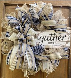 a wreath made out of burlocks with the words gather here on it