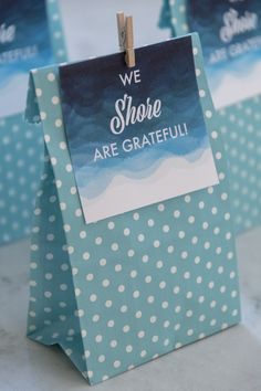 we share are grateful gift bags with clothes pins attached to the handles and tags on them