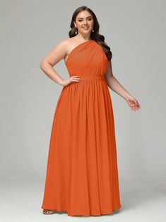 a woman in an orange dress posing for the camera with her hands on her hips