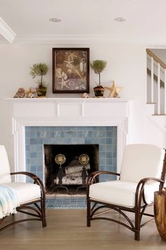 a living room filled with furniture and a fire place