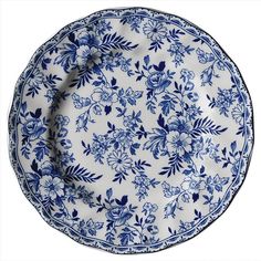 a blue and white plate with flowers on it