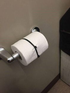 a roll of toilet paper hanging on the wall