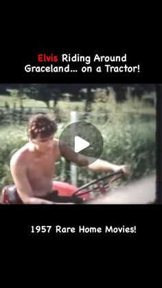 a shirtless man riding on the back of a red motorcycle next to a field