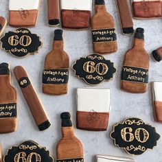 decorated cookies with bottles and labels on them