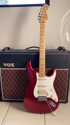 an electric guitar sitting on top of a table