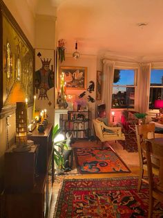 a living room filled with lots of furniture and decor on top of carpeted flooring