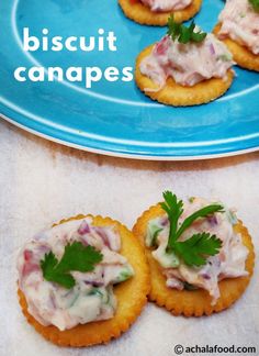 small crackers topped with meat and garnish on a blue plate