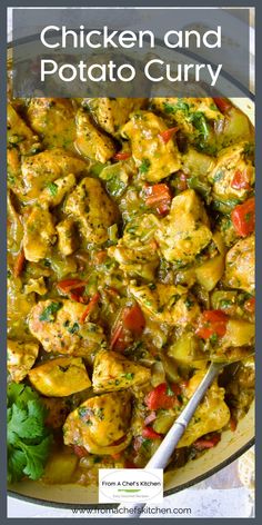 chicken and potato curry in a bowl with a spoon