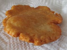 two fried food items sitting on top of a white paper towel